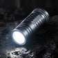 Mini rechargeable LED keychain flashlight, dark gray metal body with bright front lens
