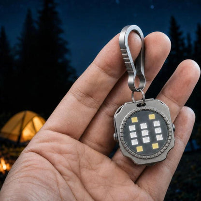 Titanium mini keychain flashlight with round LED panel and metal loop ring
