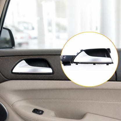 Door handle controller assembly on car door interior, shown next to inner handle