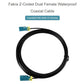 Round loop black coaxial cable with dual Fakra Z female connectors, teal housings, yellow latches.