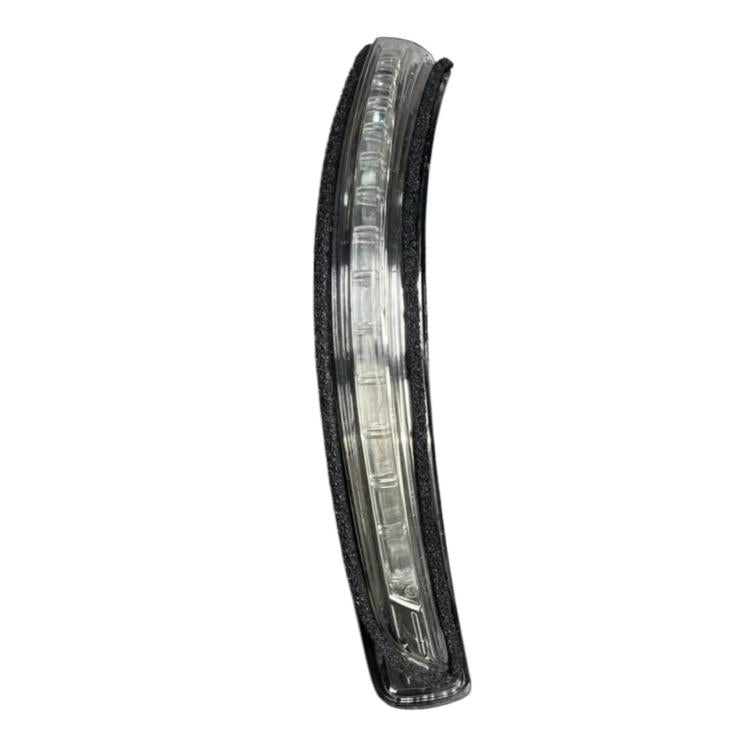 Car side turn signal light with clear lens and black housing, front view