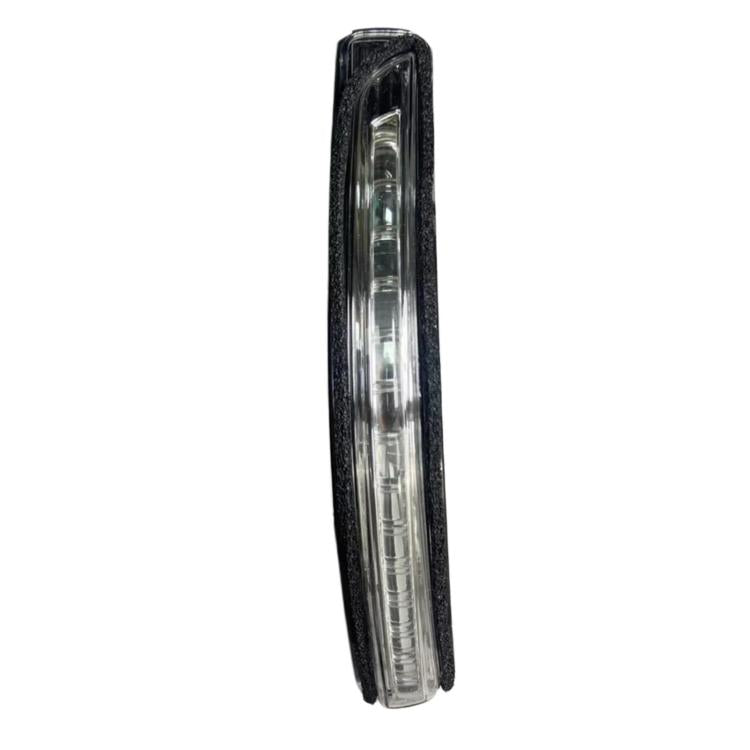 Car side turn signal light with clear lens and black housing, angled front view
