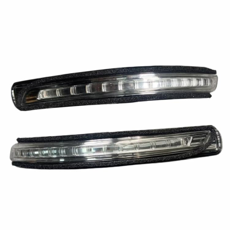 Pair of car side turn signal lights with clear lenses and black housings