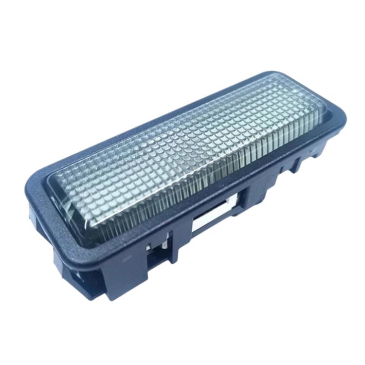 Car interior dome reading light, blue rectangular lens with side mounting tabs