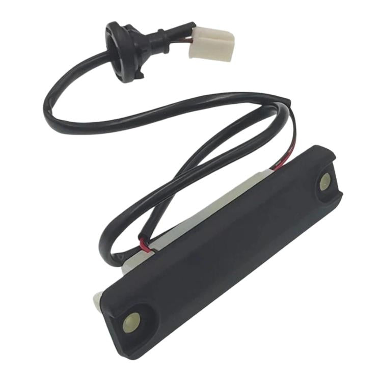 Trunk lid switch with black housing, light gray insert, wiring cables