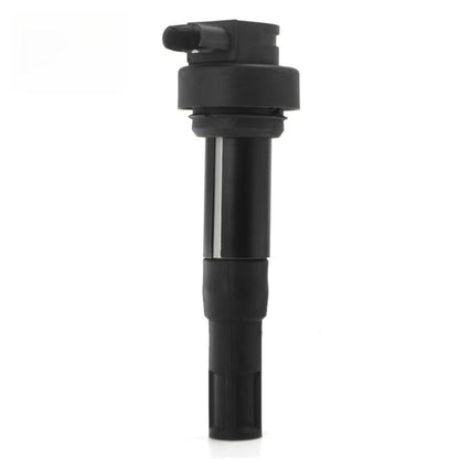 Black ignition coil with rubber boot and electrical connector, upright view.