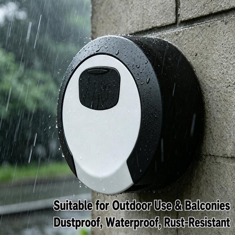 Outdoor black-and-white circular 4-digit key lock box with raindrops on it.