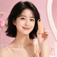Beige rechargeable heated eyelash curler with clear clamp, held near face