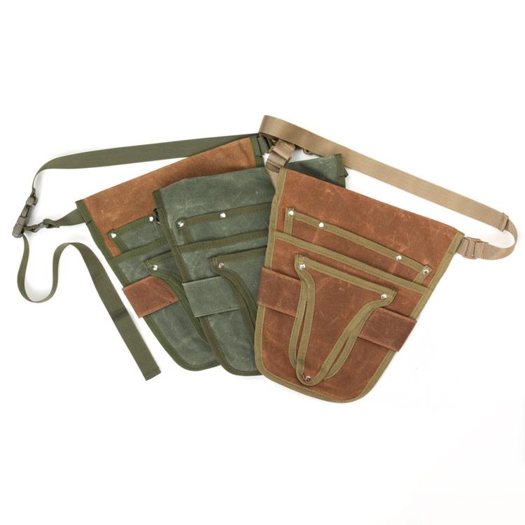 Two-tone waxed canvas waist bag, angled view, with multiple front compartments and loops