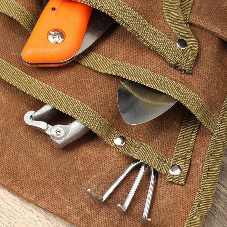 Waist bag tool loops and metal hooks on waxed canvas, with snap-secured straps
