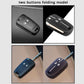 Two-button folding key cover in use on key fob, blue and black variants