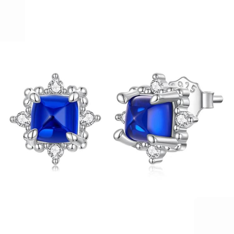 Sterling silver stud earrings with square blue gemstone and halo of clear stones