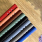 A5 6-hole magnetic buckle notebook, metal spine rings visible on multiple colored covers