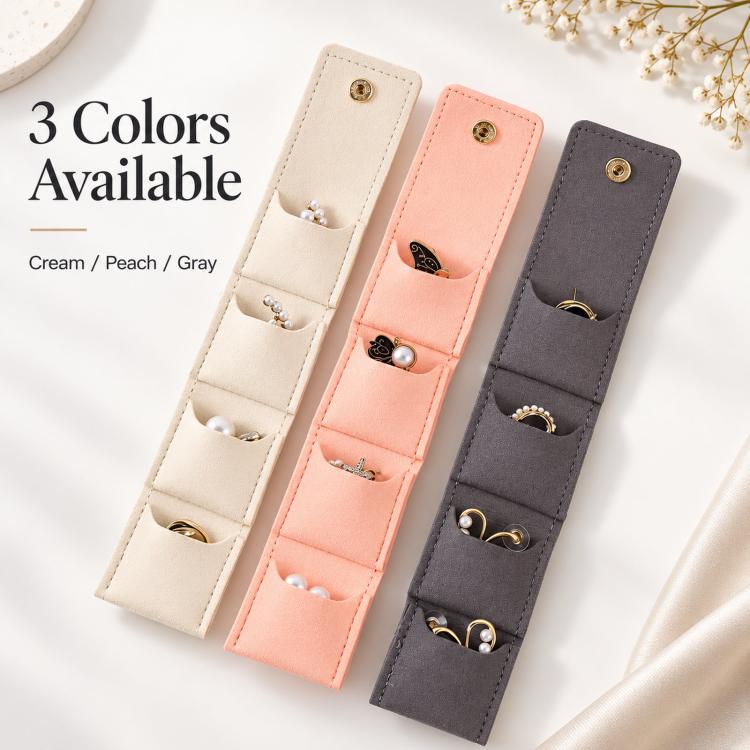 Set of mini jewelry pouches in cream, peach, and gray with snap-button closures.