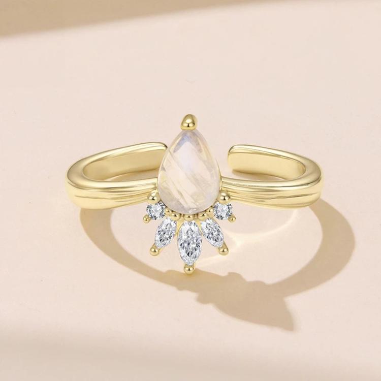 Gold-tone open adjustable ring with pear-shaped moonstone and crystal drops