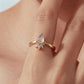 Teardrop moonstone adjustable open ring on finger, gold-tone band with crystal crown