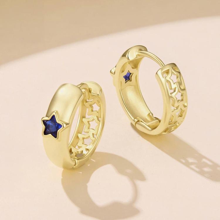 Gold-tone hoop earrings with blue star enamel and textured outer edge