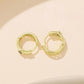 Gold-tone hoop earrings with textured back and hinge