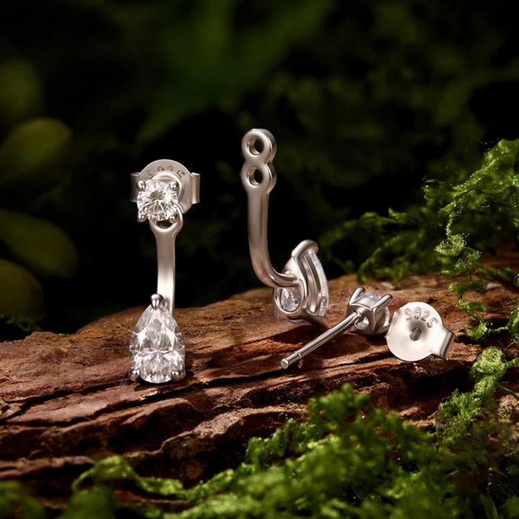 Sterling silver teardrop moissanite stud drop earrings, showing curved back and pear stones