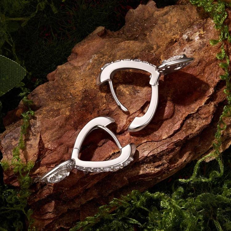 Sterling silver heart-shaped hoop earrings with hanging heart charm and stones