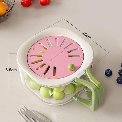 Pink collapsible fruit and vegetable colander with circular vented lid and side handle