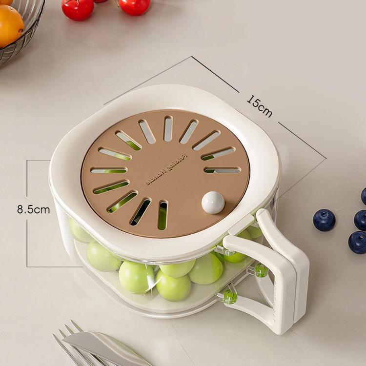 Brown vented lid collapsible fruit colander with green produce and white side handle