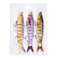 Set of three jointed swimbait fishing lures with treble hooks, pale orange, purple and gold colors