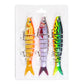 Set of three jointed swimbait fishing lures with treble hooks, orange, pink and neon green colors