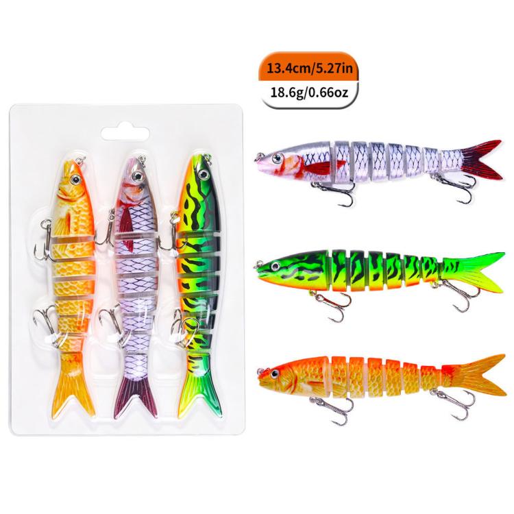 Three jointed swimbait fishing lures with treble hooks in a clear blister pack