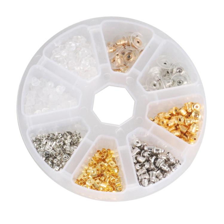 Round compartment organizer with mixed earring backs in gold, silver, and clear