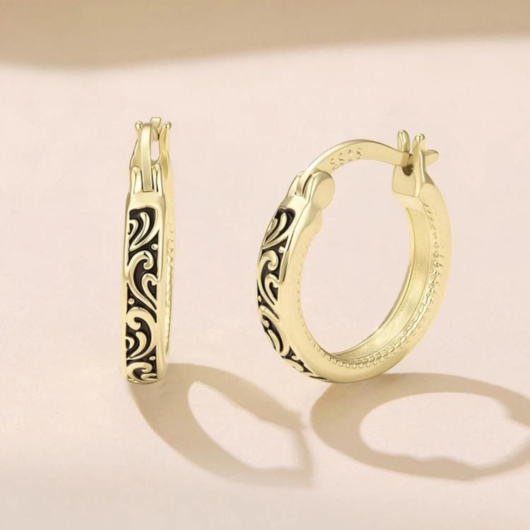 Gold-tone hoop earrings with vintage scroll pattern and hinged clasp posts