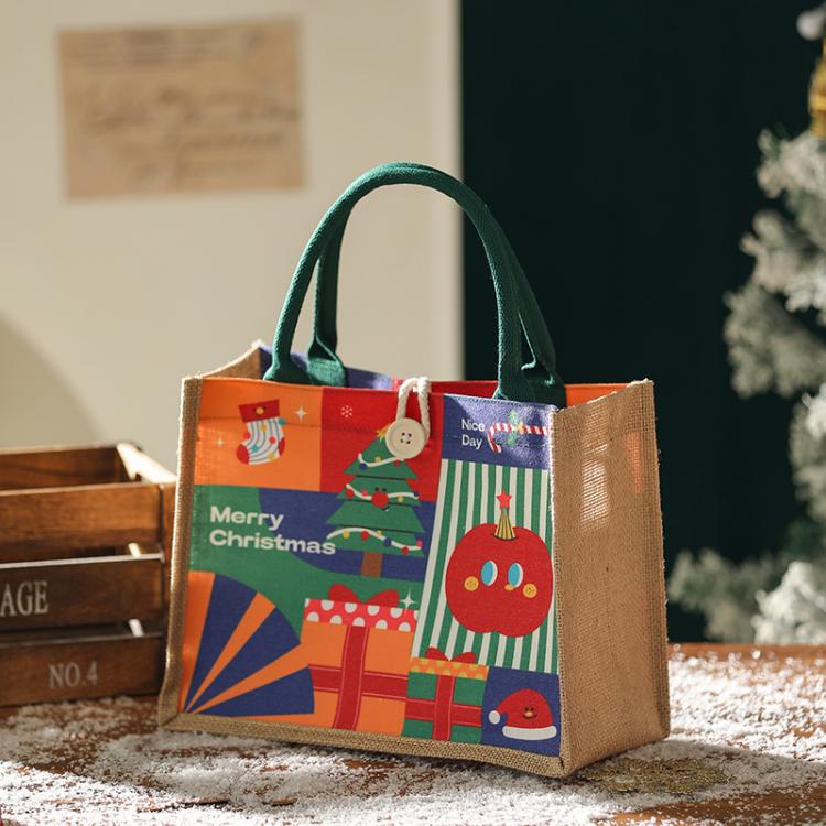 Jute Christmas tote bag with green handles, “Merry Christmas” multicolor gift print
