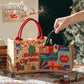 Pair of jute Christmas tote bags with red and green handles, festive seasonal prints