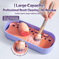 Purple makeup brush cleaning box with orange insert holding brushes during washing