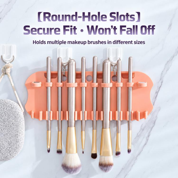 Orange insert makeup brush drying rack with round-hole slots holding multiple brushes