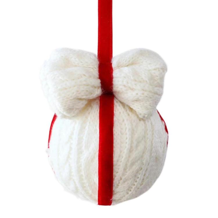 White knitted bow ornament with hanging red cord and vertical red stripe
