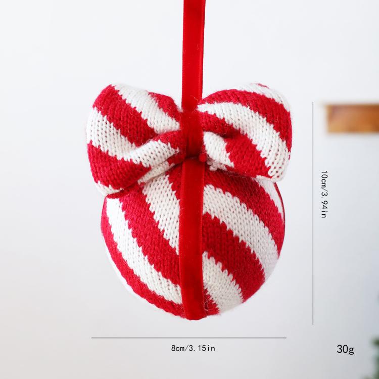Red and white striped knitted bow ornament, front view, with hanging red cord