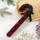 Velvet candy cane ornament with red velvet body and dark green striped ribbon, hanging loop