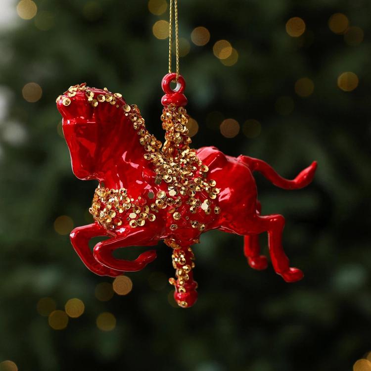 Red rocking horse ornament with gold glitter trim and hanging loop