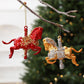 Red and gold glitter rocking horse ornaments with hanging loops