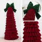 Dark red tiered Christmas tree ornament with large green bow