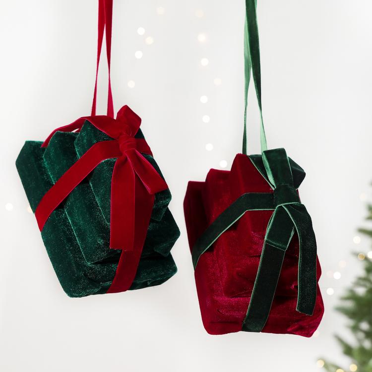 Pair of velvet gift box hanging ornaments: dark green with red ribbon, and wine red with green.