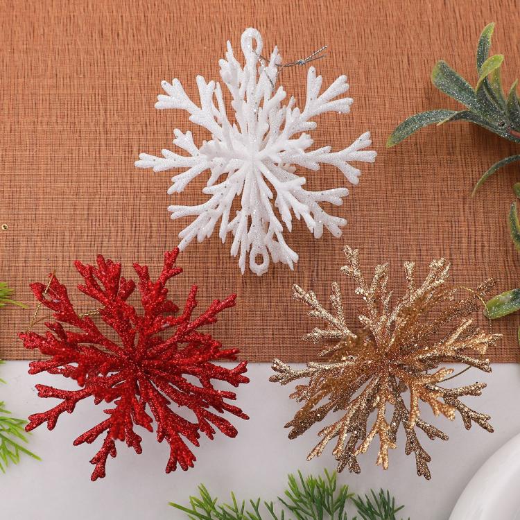 Glitter snowflake ornaments in white, red, and gold with hanging loops