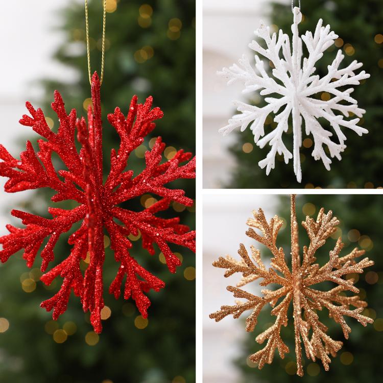 Glitter snowflake ornaments in red, white, and gold with hanging strings