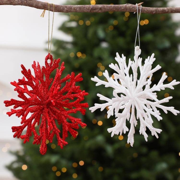 Red and white glitter snowflake ornaments with hanging strings for the tree