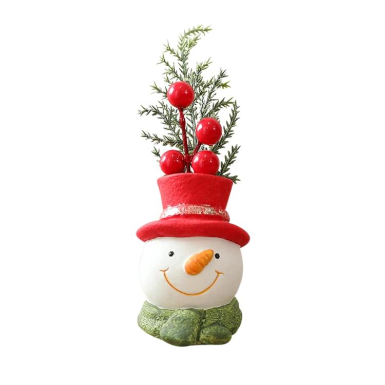 Christmas gnome ornament snowman with red top hat, green scarf, holding red berry greenery