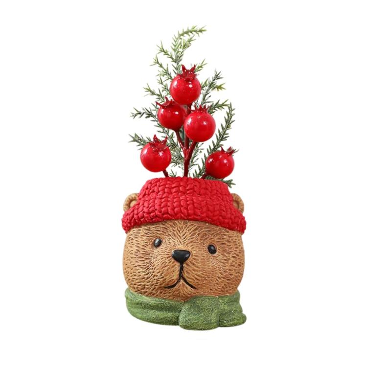 Christmas gnome ornament bear with red knit cap, green scarf, holding red berry greenery