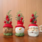 Set of three Christmas gnome ornaments: bear, snowman, and Santa with red berry stems