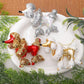 Assorted poodle Christmas ornaments: red and gold, plus white and silver sequined