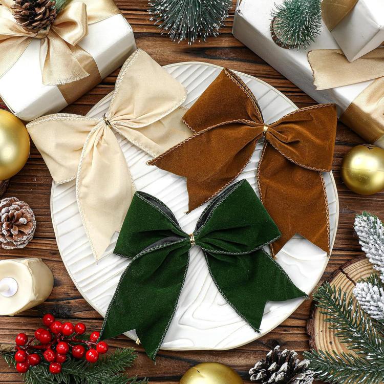 Fabric bow ornaments on white base: cream, brown, and green bows